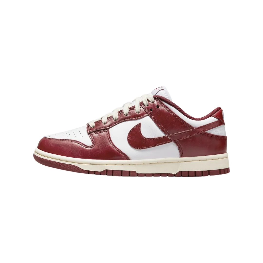 Nike Women's Dunk Low Vintage Red Nike Dunk sneakers with classic silhouette