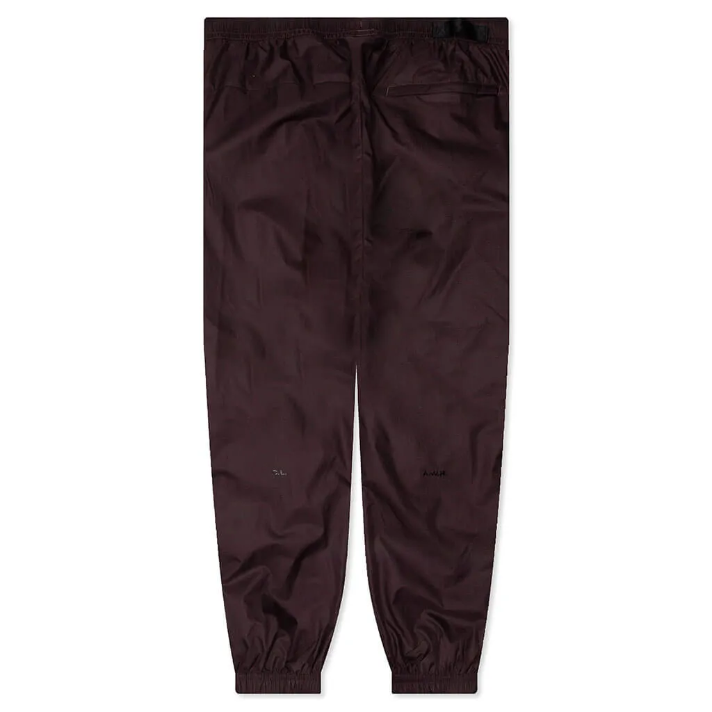 NRG Nocta Track Pant DR - Dark Wine/Black Nike trainers with responsive foam