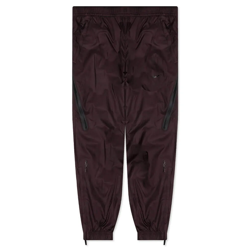 NRG Nocta Track Pant DR - Dark Wine/Black Nike signature design with comfort fit
