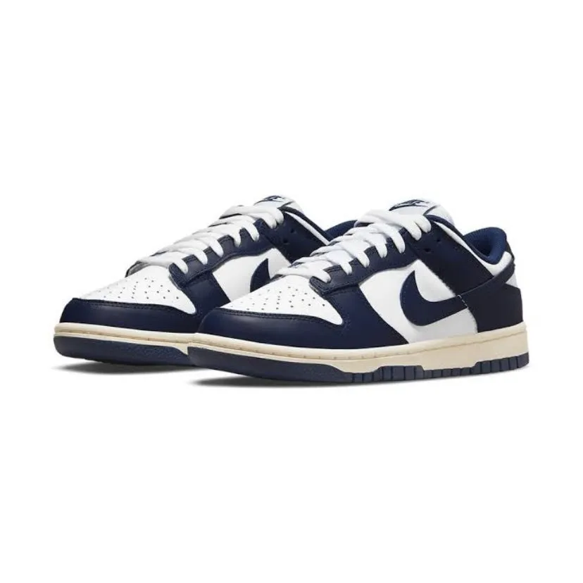 Women's Dunk Low White Navy Vintage Cream Nike Dunk sneakers with classic silhouette
